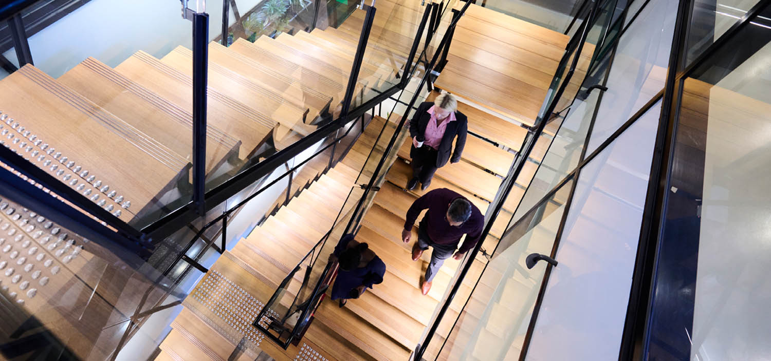 People walking down a stairwell