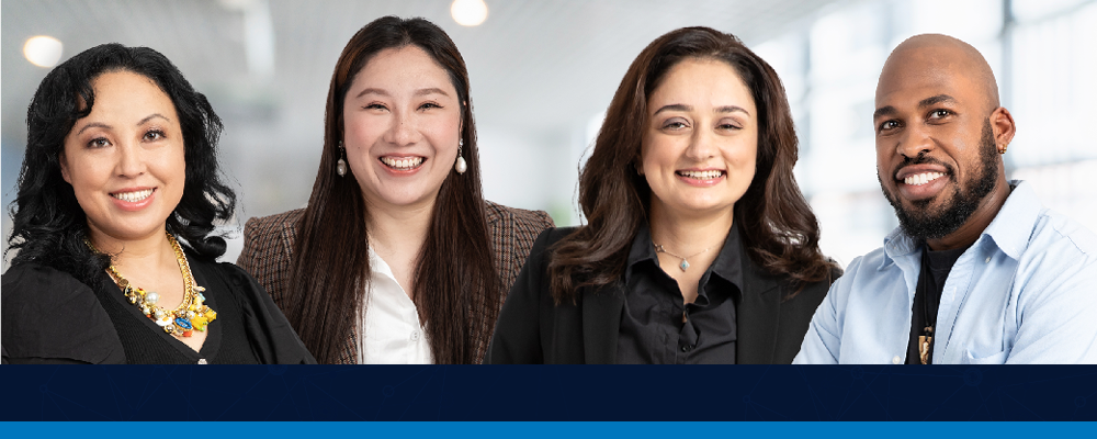 image of 4 people smiling at the camera